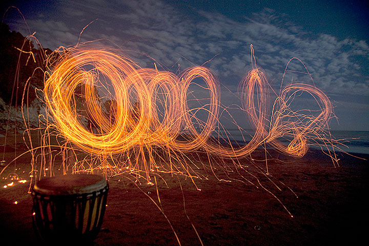 Light track from carbon neutral fire spinning toys made from Euculyptus bark. The person was
