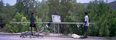 Transport bike with pipe and plumbing maintenance crew.