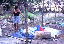 Slowing the cure of the concrete well cap with water.